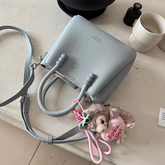 حقيبة يد نسائية صغيرة أنيقة مع حليّة جذابة لون ازرق فاتح - KSA